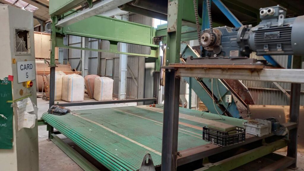 Raw New Zealand wool entering Ywool machinery to become sustainable wool products NZ